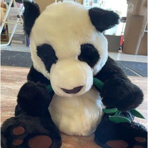 FAO Schwarz stuffed panda eating bamboo